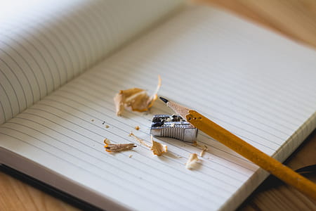 Photo of a notepad with pencil and shavings